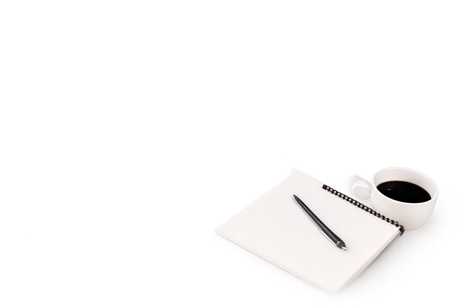 Notebook, pen and a cup of coffee on a desk